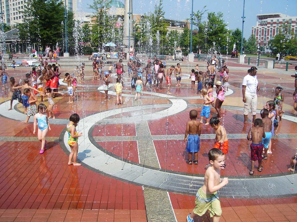 children playing in the water spray at Rings Fountain at Centennial Olympic Park